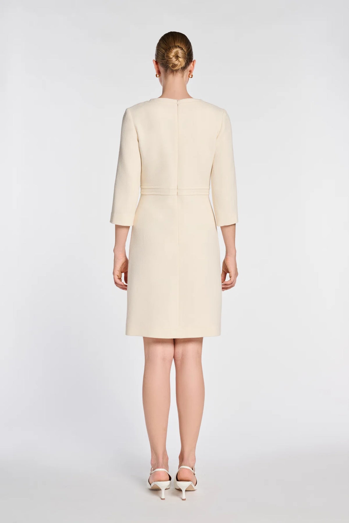 Back view of Weill ivory wool dress with three-quarter sleeves and concealed zipper