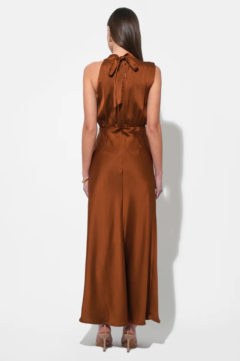 Back view of copper satin halter tie maxi dress with fluid skirt—elegant formalwear at BTK COLLECTIONS.