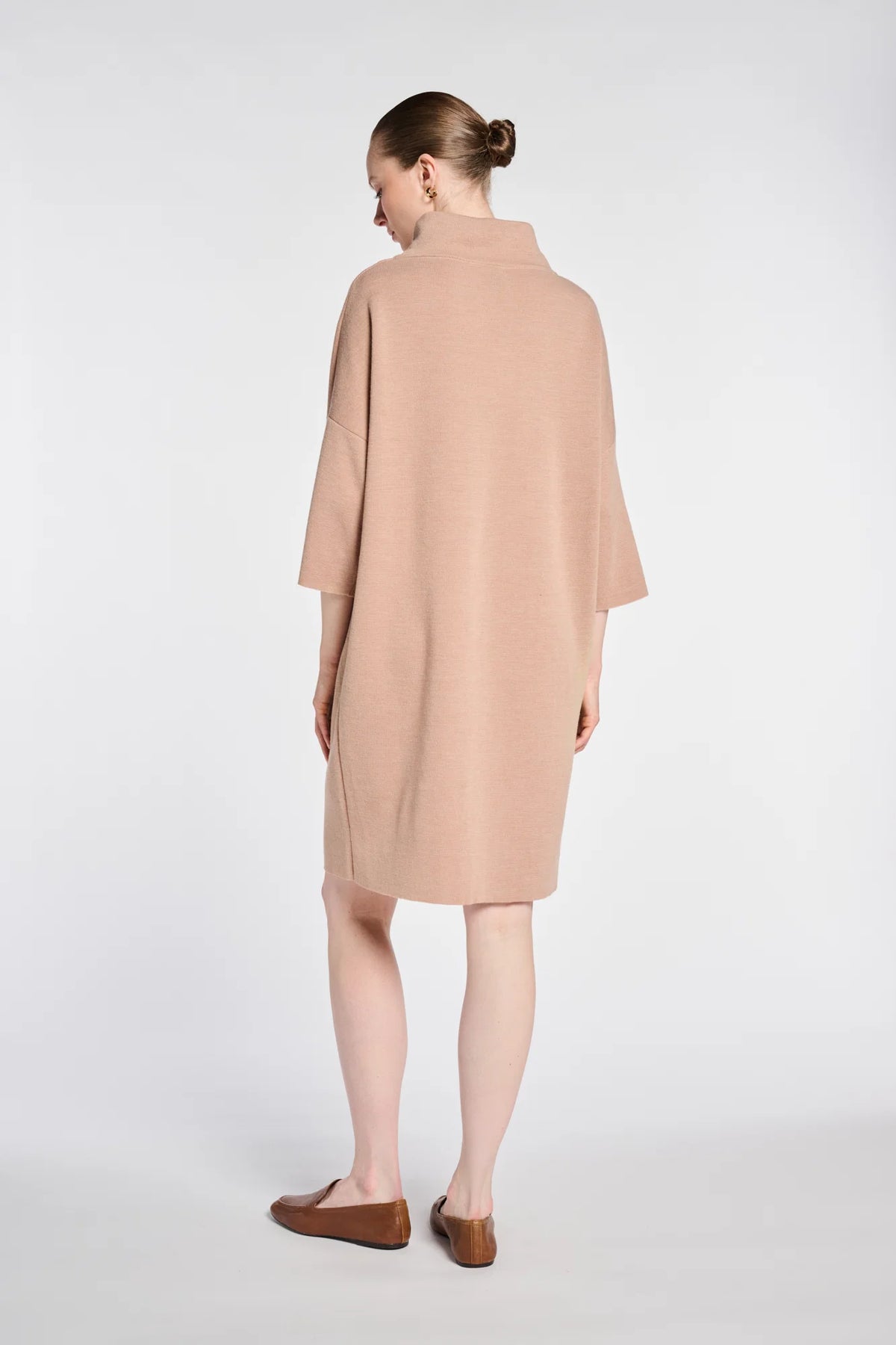 Back view of WEILL beige high-neck knit sweater dress with a relaxed straight silhouette