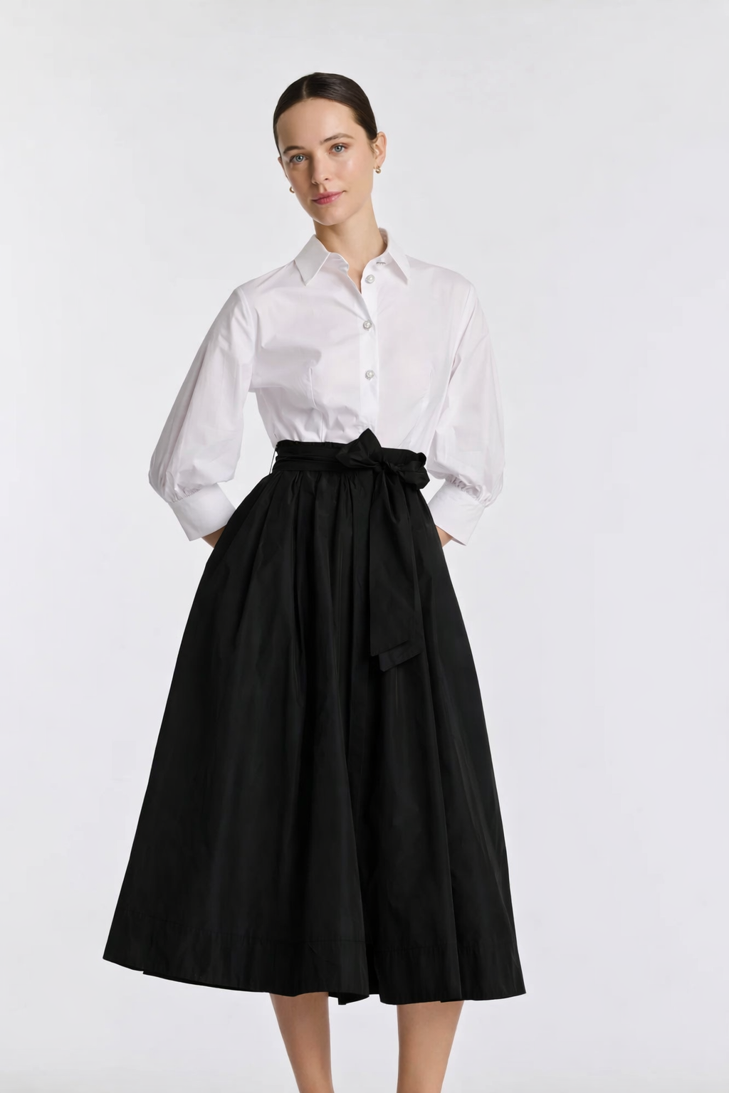 Black and white fit-and-flare shirt midi dress with defined waist and full skirt
