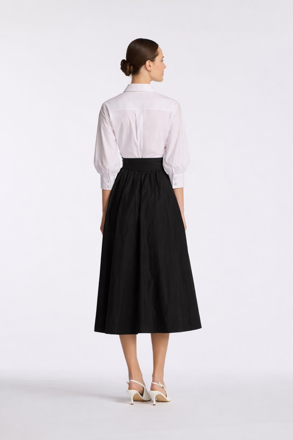Black and white feminine fit-and-flare midi dress with collared neckline