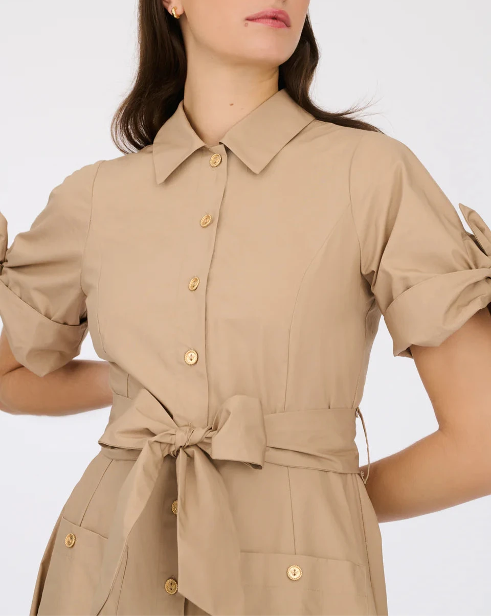 Elegant shirt dress in camel tone with structured fit, gold buttons, and feminine sleeve accents"