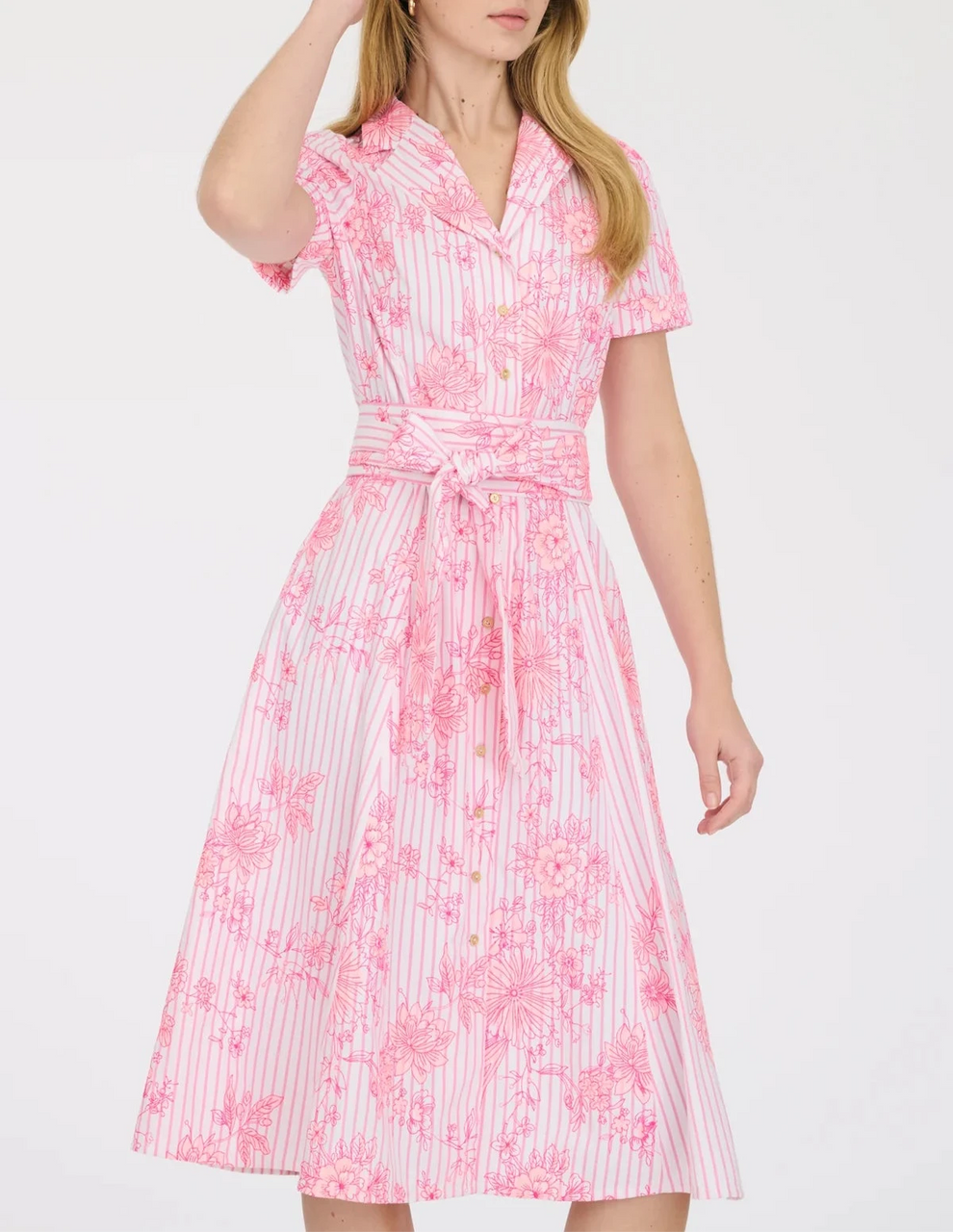 Model wearing Weill Paris pink floral shirt dress with short sleeves, embroidered detail, and flattering waist tie