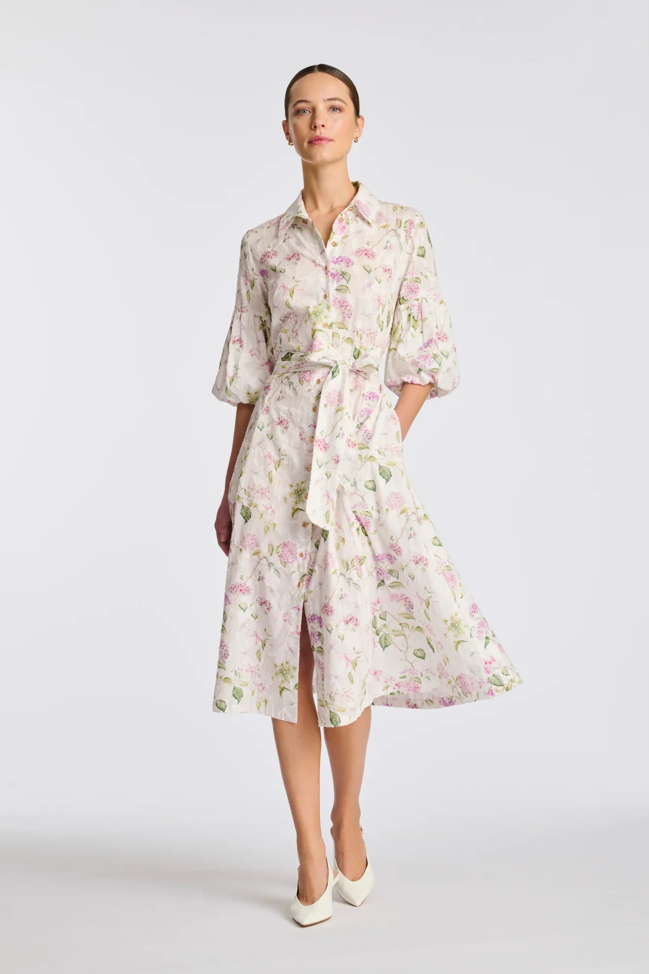 Floral cotton midi shirt dress with puff sleeves and flowing midi skirt on model