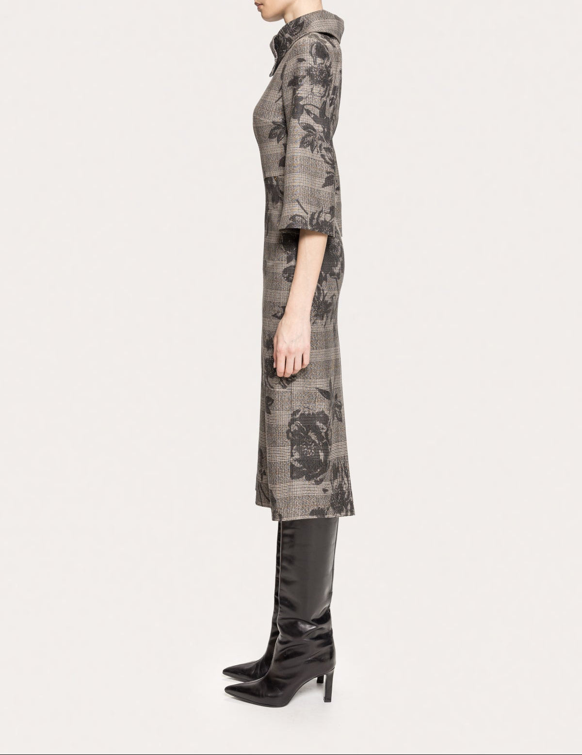 Side view of NISSA gray floral plaid midi dress with an asymmetric collar and three-quarter sleeves.