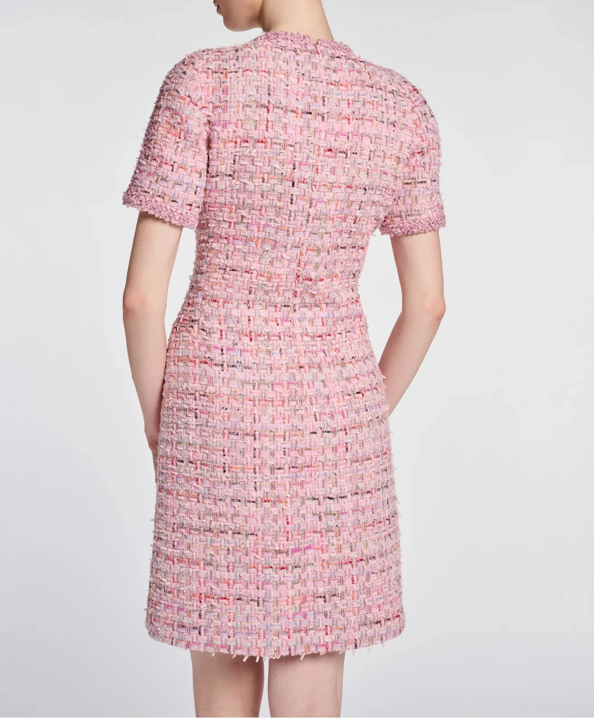 Three-quarter back view of a Weill Paris pink tweed dress showing waist shaping and short sleeves.