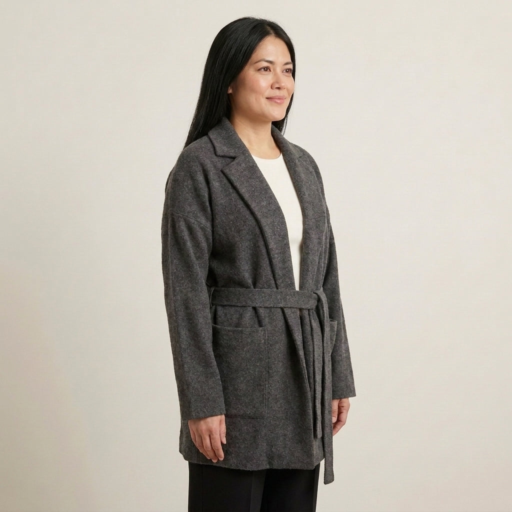 Three-quarter view of Allie Rose charcoal wrap jacket with a tied knit belt, long sleeves and patch pockets.