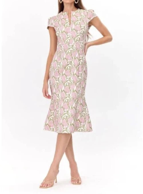 Model wearing pink floral jacquard cap sleeve midi dress by Adelyn Rae, ideal for spring weddings and day events.