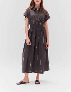 Front view of a woman wearing Grade & Gather Kombu Cotton Print Shirt Dress with cap sleeves and tiered skirt