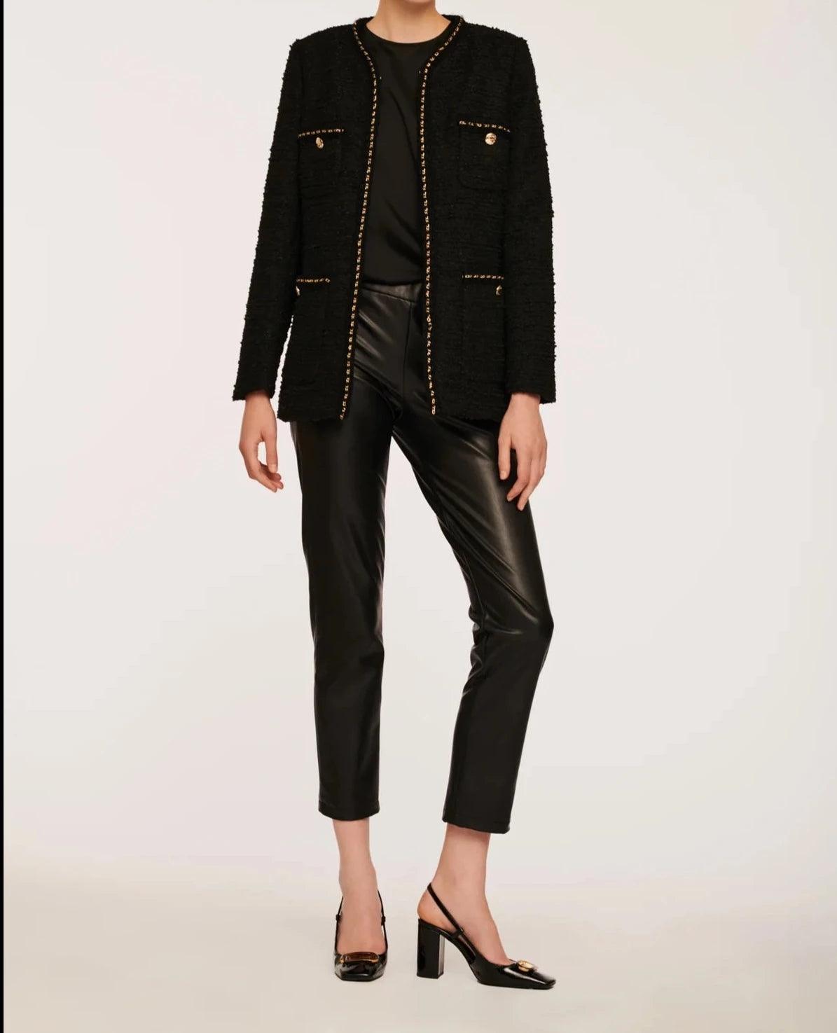 Women’s black tweed jacket with gold chain trim in a straight mid-length silhouette by Weill Paris