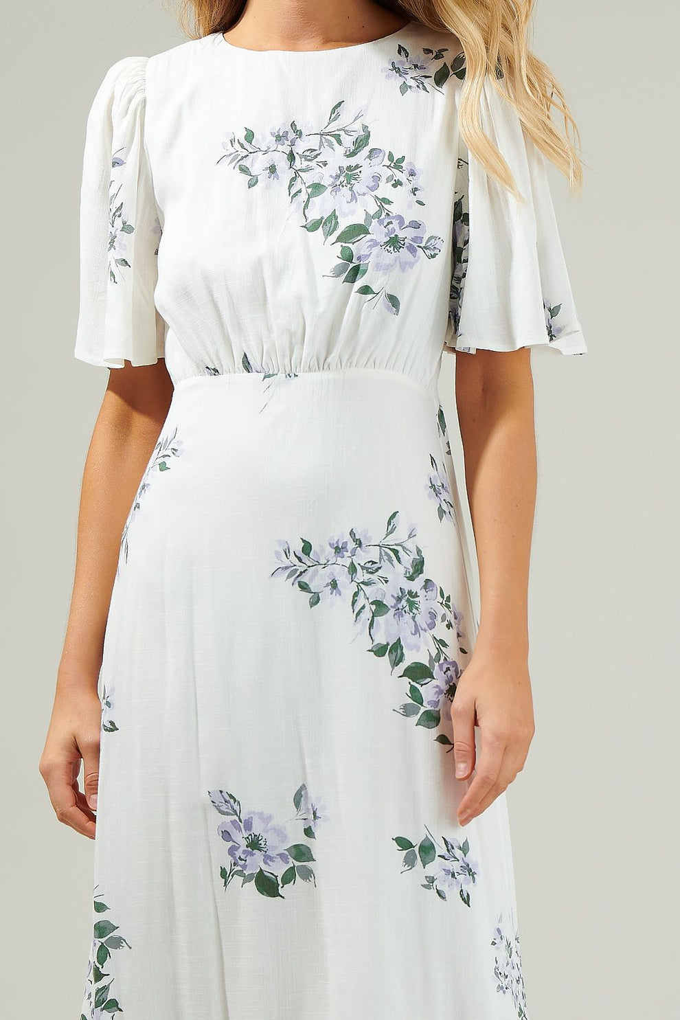 Close-up of floral pattern and waist detail of the Sugarlips Porto Dress