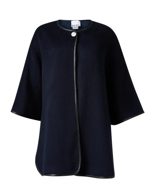 Navy cape: Navy reversible wool cape by Weill with leather‑trim edge and snap closure