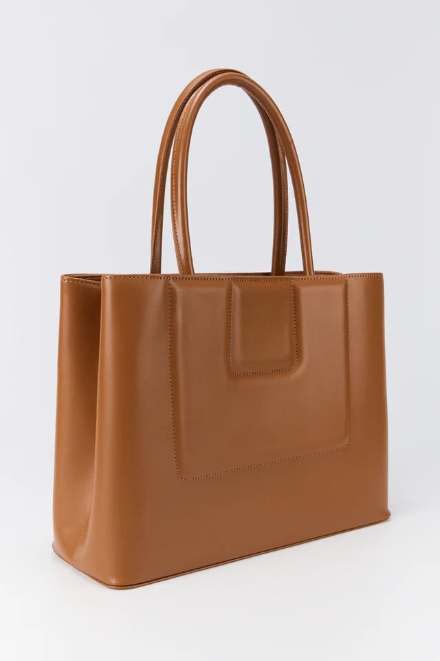 Tan calfskin leather quilted tote bag with top handles and structured silhouette