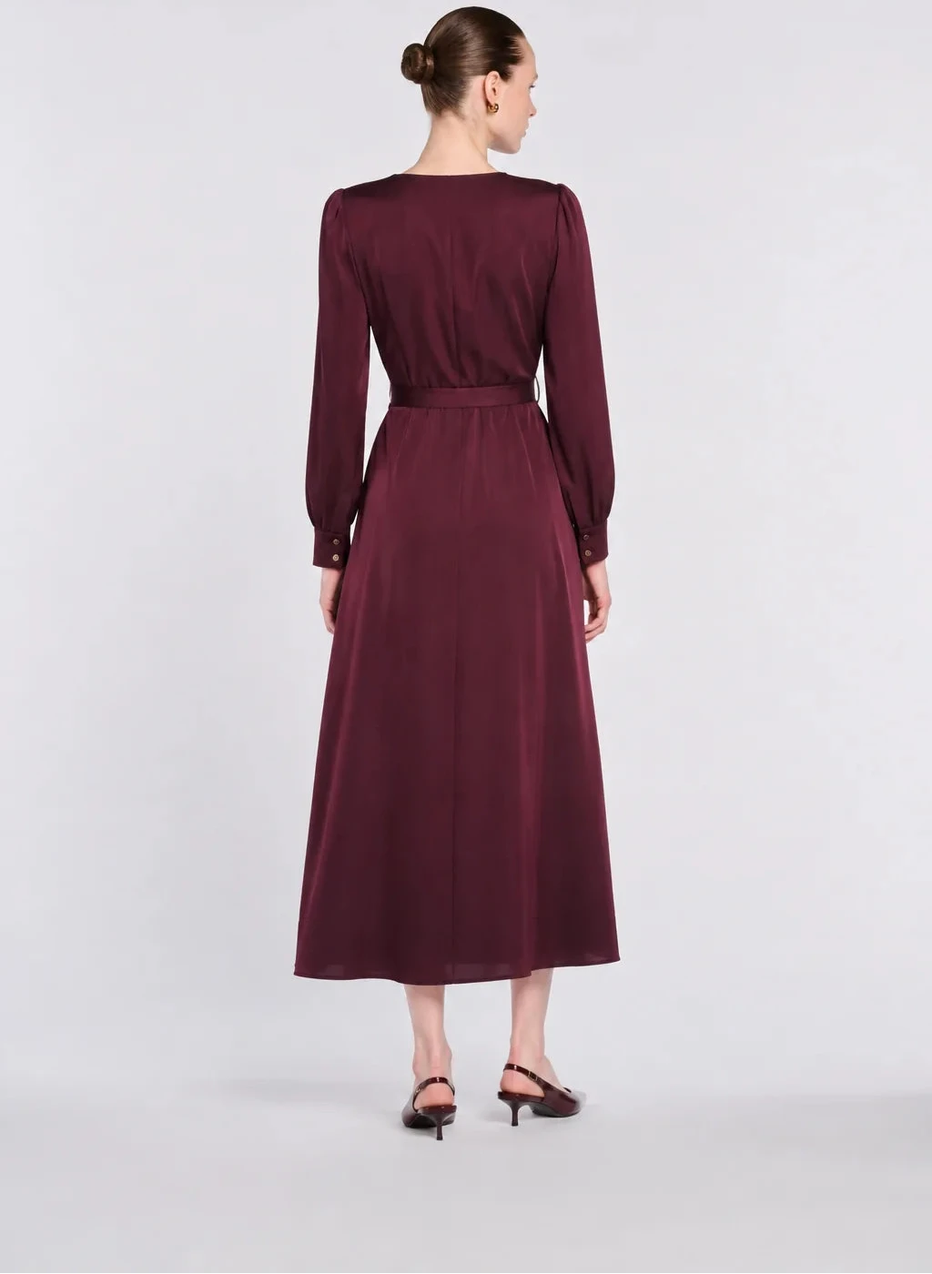 Back view of WEILL Paris burgundy satin midi dress showing a defined waistband, flared skirt and buttoned cuffs.