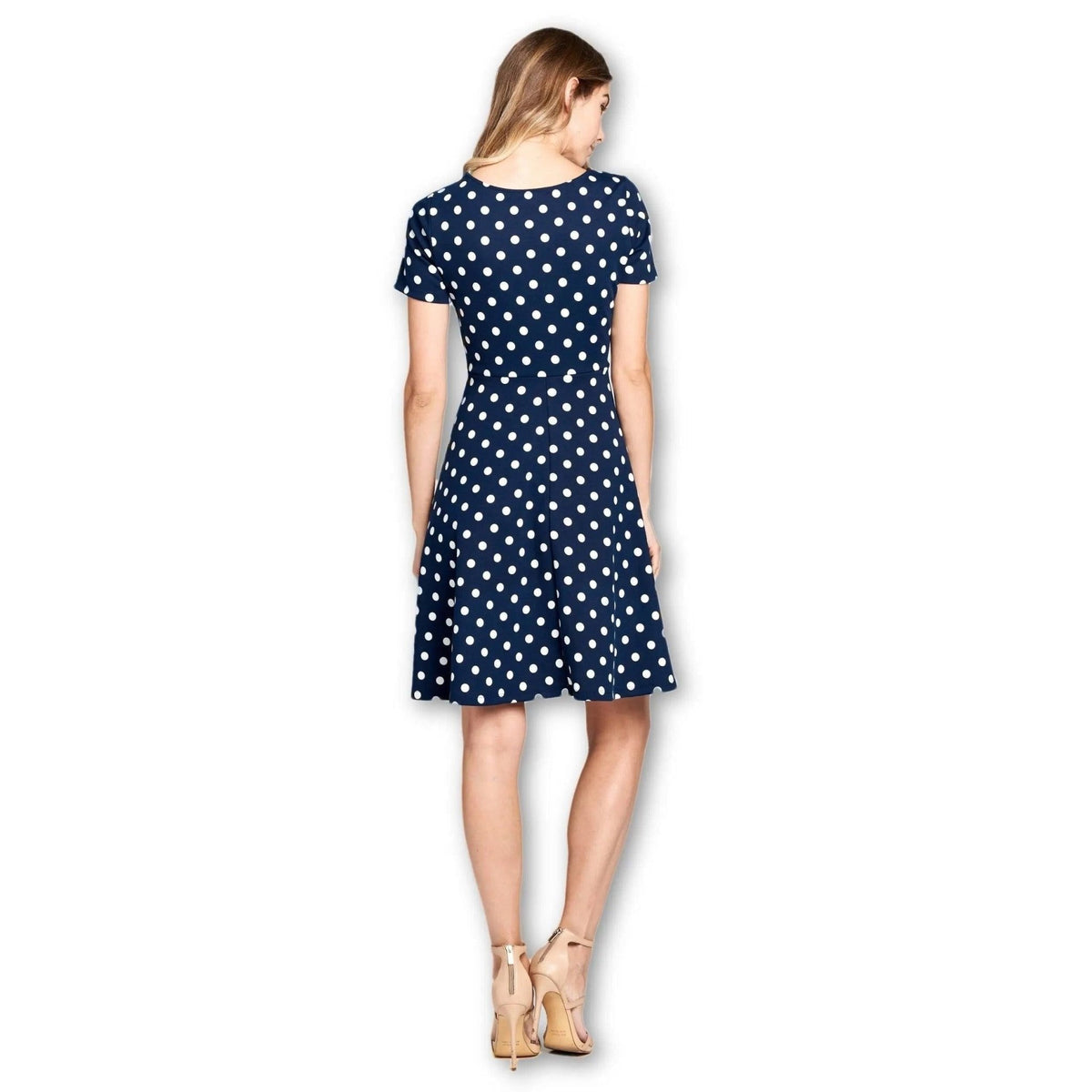 Back view of the LKLUV navy and white polka dot dress with short sleeves, a waist seam and flared skirt