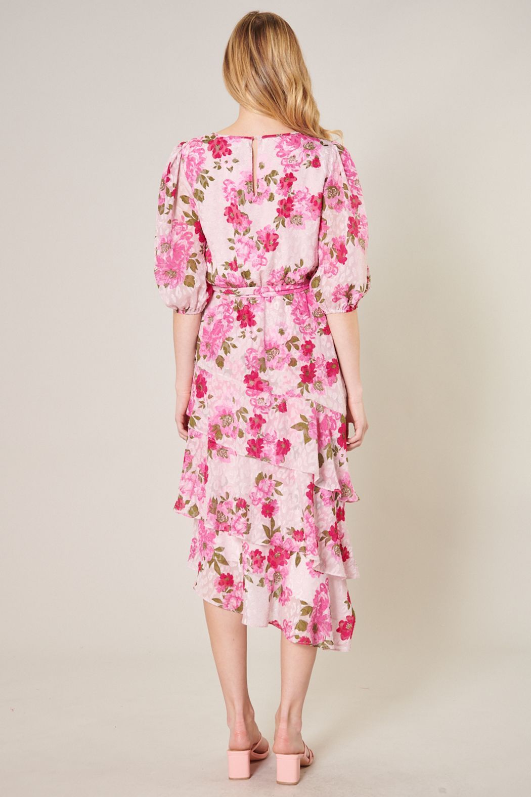 Back view of pink floral midi dress with keyhole back and 3/4 sleeves