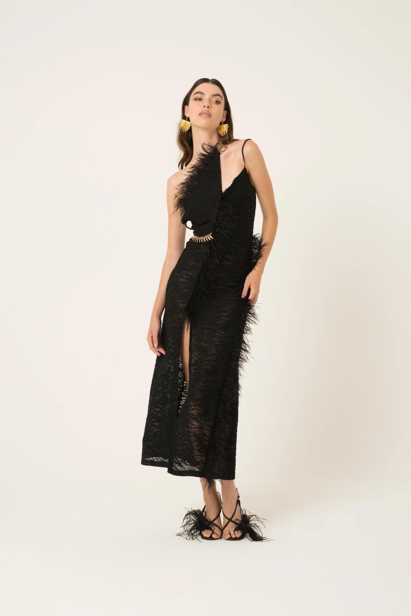 Black one-shoulder feather trim midi dress with front slit and gold waist detail
