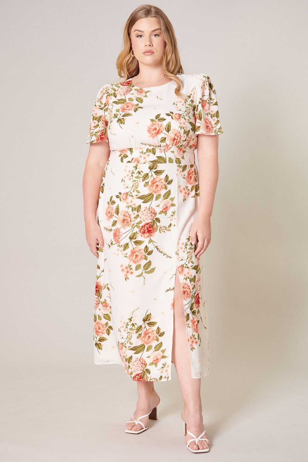 Front view of Sweet On You Bloom Curve Midi Dress in ivory with peach florals and front slit