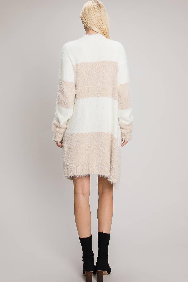 Back view of the Tan and ivory eyelash cardigan showing broad horizontal color blocks and long sleeves.
