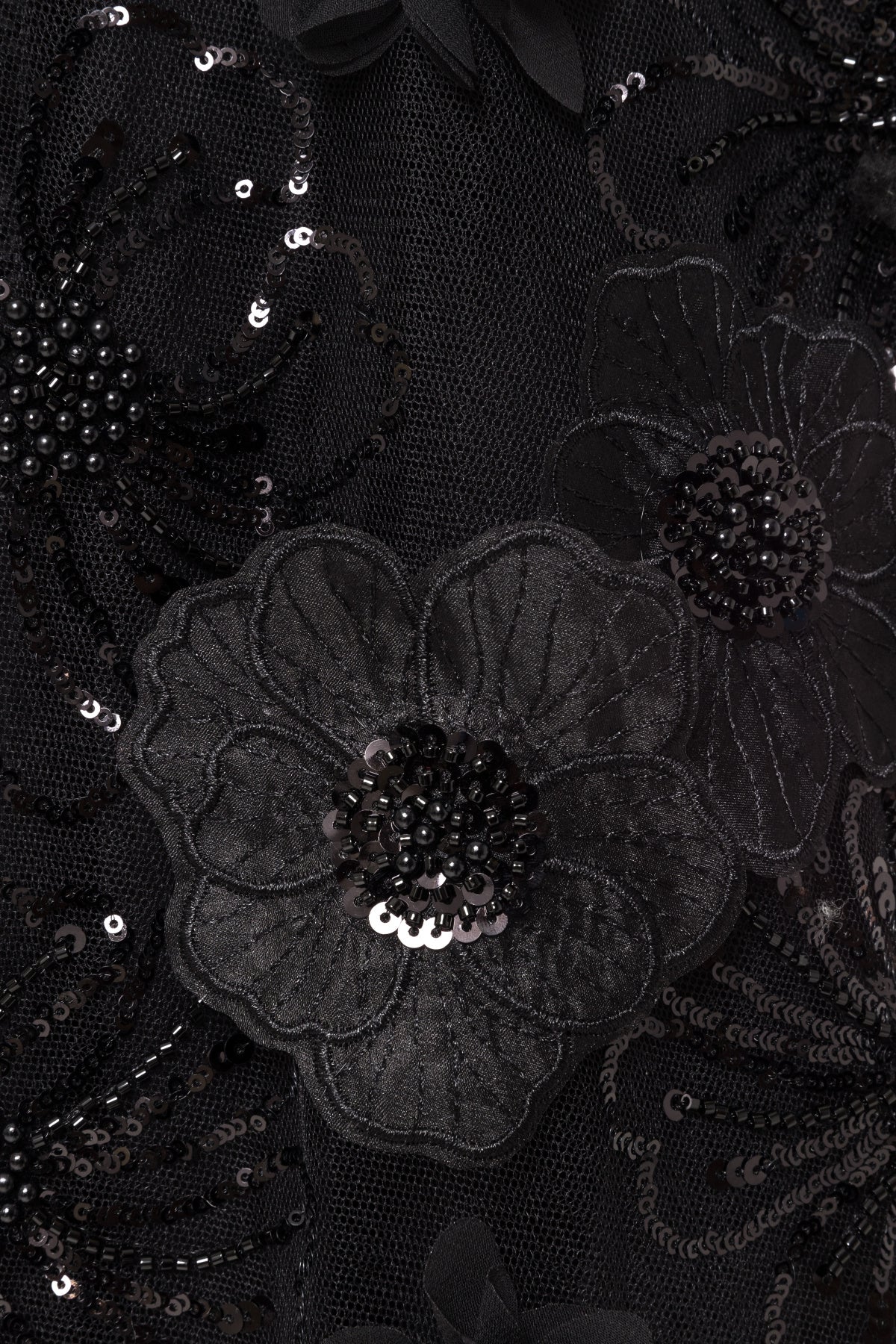 3D black floral appliqué with sequins and beads on tulle.
