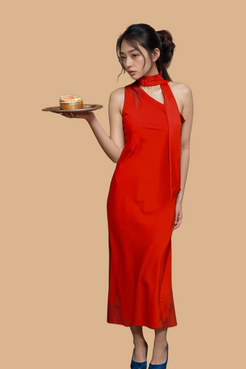 Woman in red one-shoulder halter midi dress with scarf tie, perfect for elegant evening events.