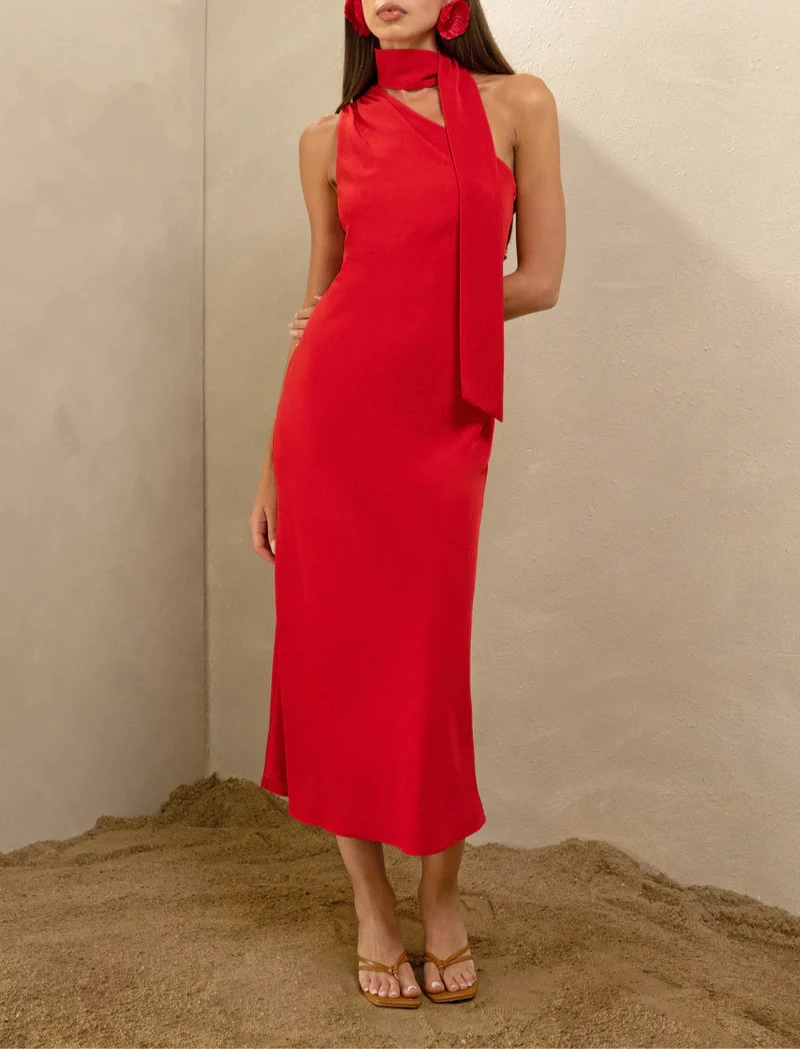 Red halter-neck midi dress with scarf detail, ideal for evening wear
