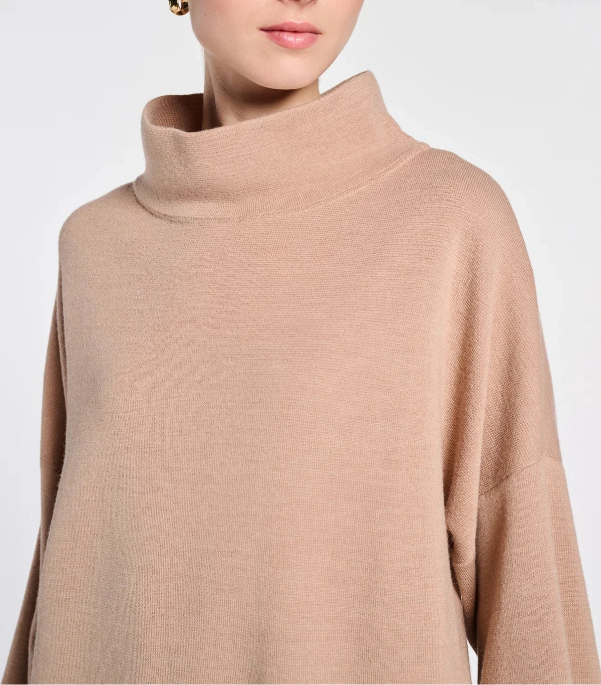 Close-up of WEILL beige wool-blend sweater dress showing the high neck and fine knit texture