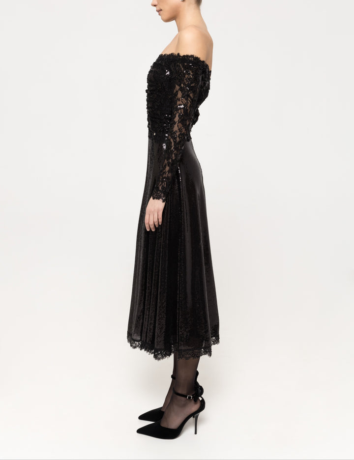Side view showing fitted, fully sequined lace bodice and sleeves with flared sequin midi skirt.