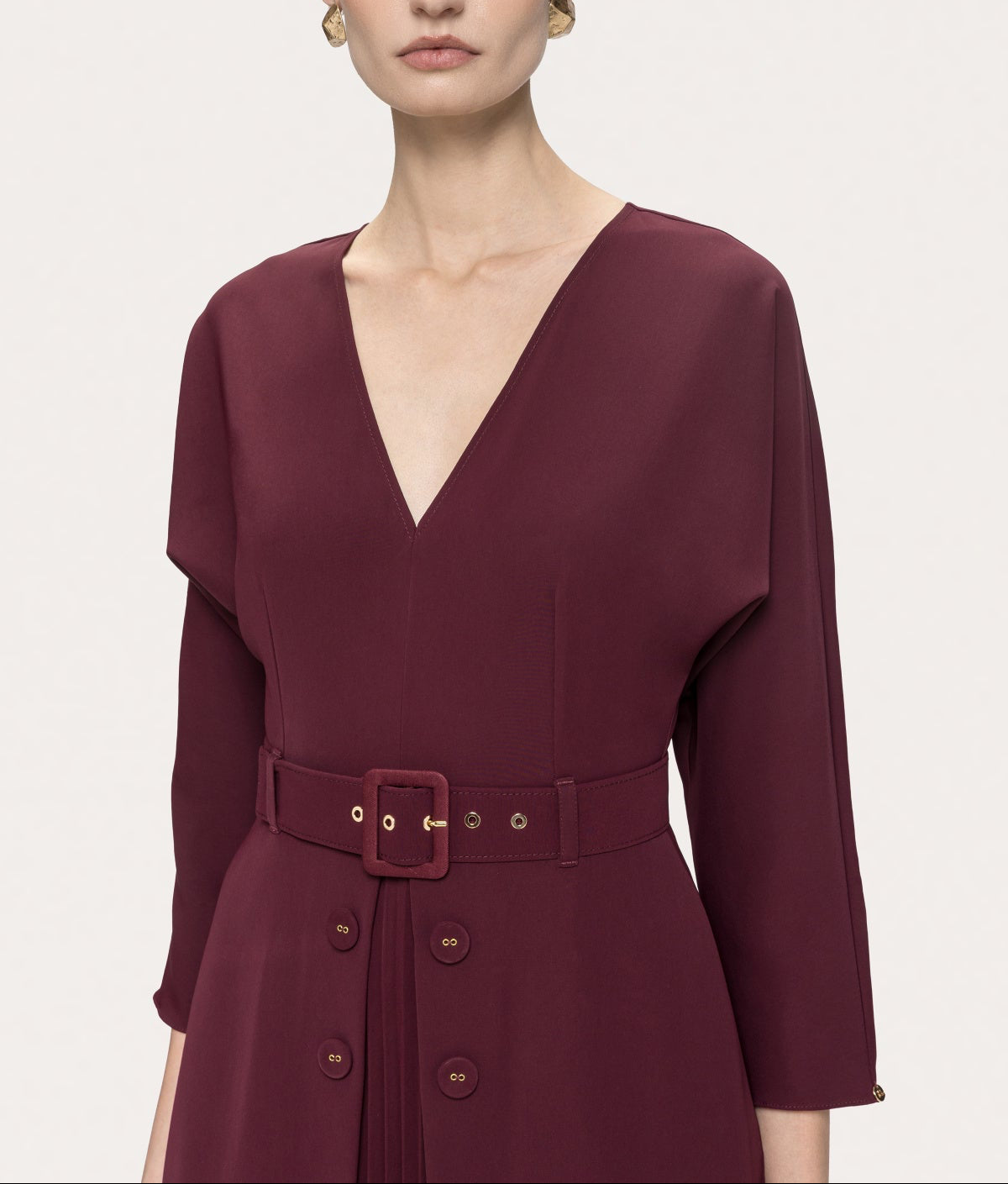 NISSA Bordeaux midi dress showing the V-neckline, matching buckle belt, four decorative buttons and front pleated panel.