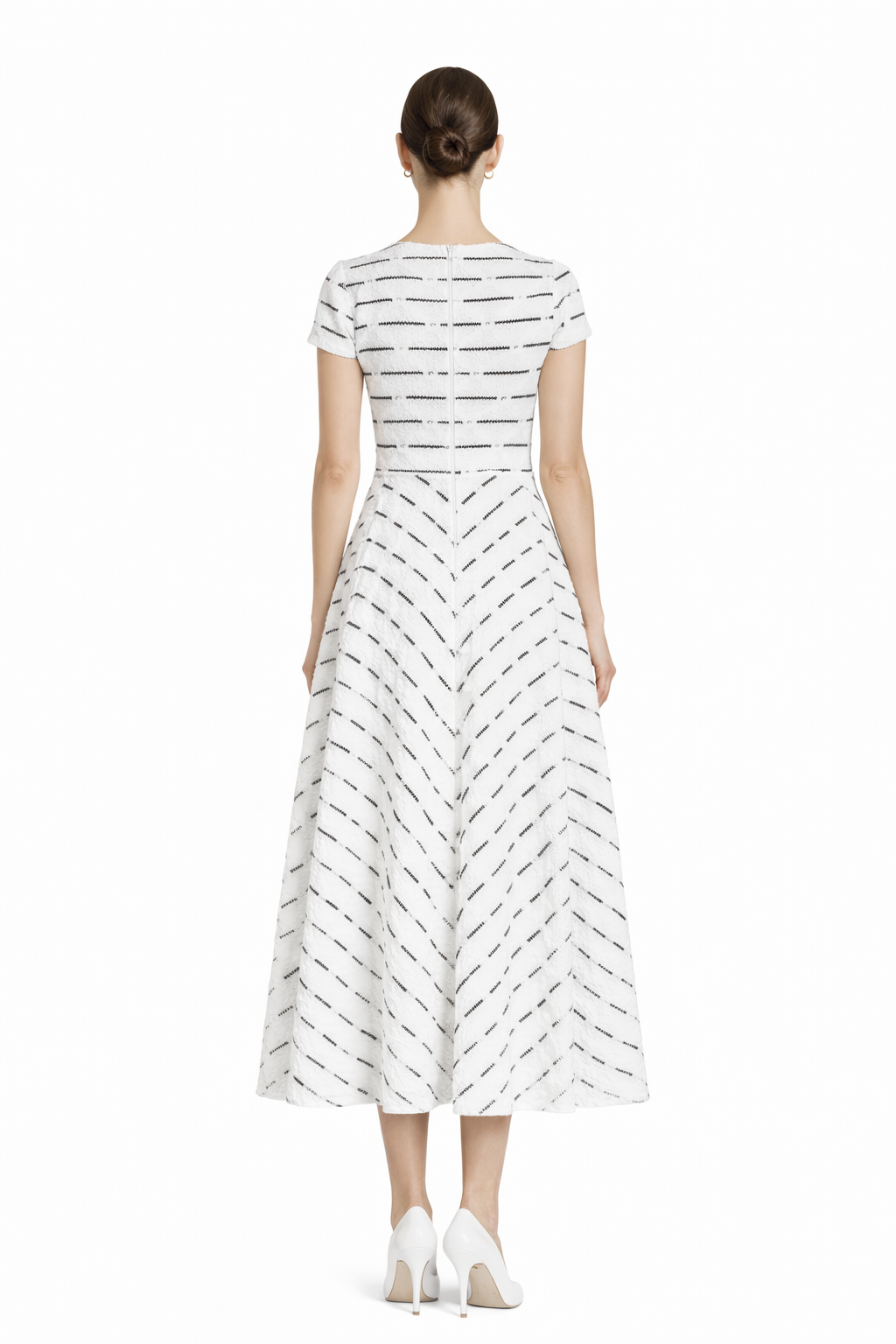 Back view of black and white lace fit and flare midi dress with zipper closure.