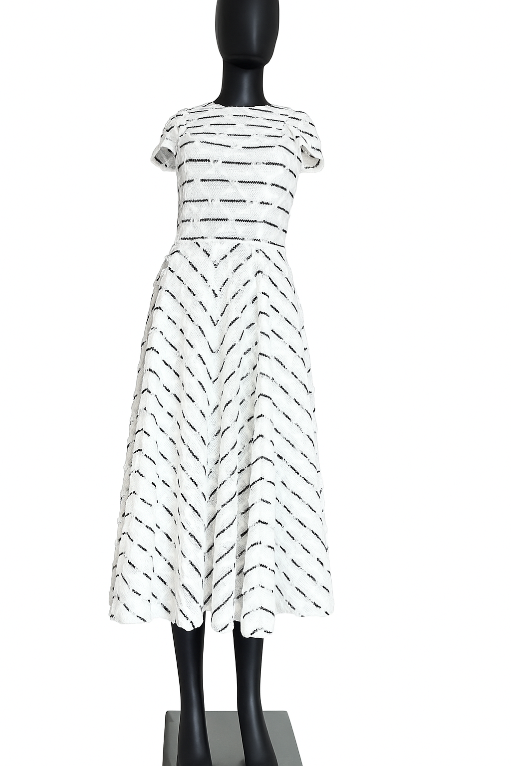 Nora Noh Breton Lace Midi Dress featuring black and white chevron stripes, delicate floral lace texture, cap sleeves, and classic round neckline.