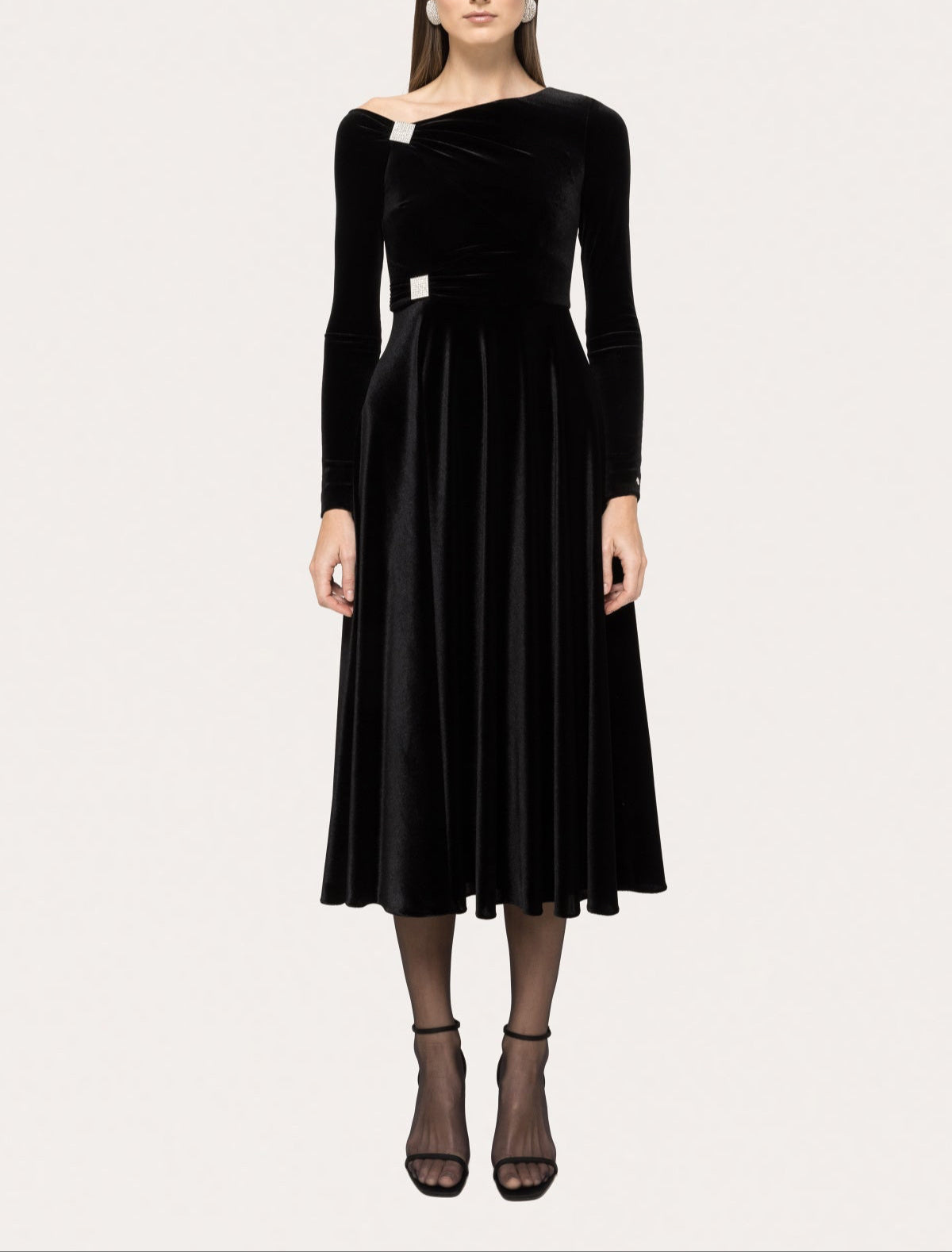 black velvet long‑sleeve midi with asymmetric off‑shoulder neckline and crystal accents
