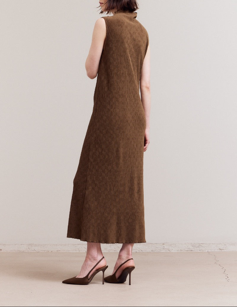 Back three‑quarter view of the dark moss sleeveless mock‑neck crinkled velvet midi dress, showing the smooth column shape from behind.