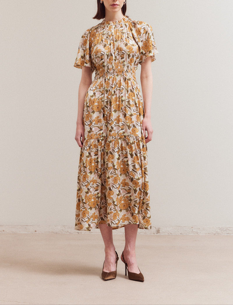 Full-length view of flutter sleeve tiered maxi dress in ochre and sage floral print