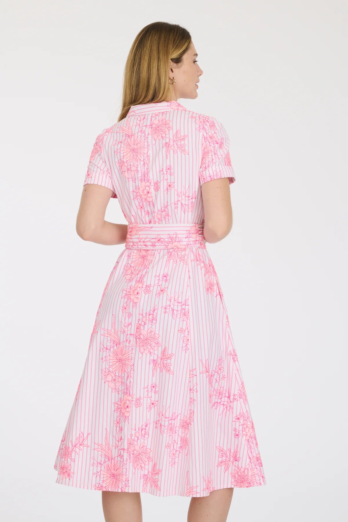 Feminine blush pink embroidered shirt dress styled with flats for daytime wear