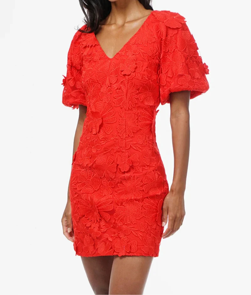 Red mini dress with puff sleeves and 3D floral lace detailing by ADELYN RAE.