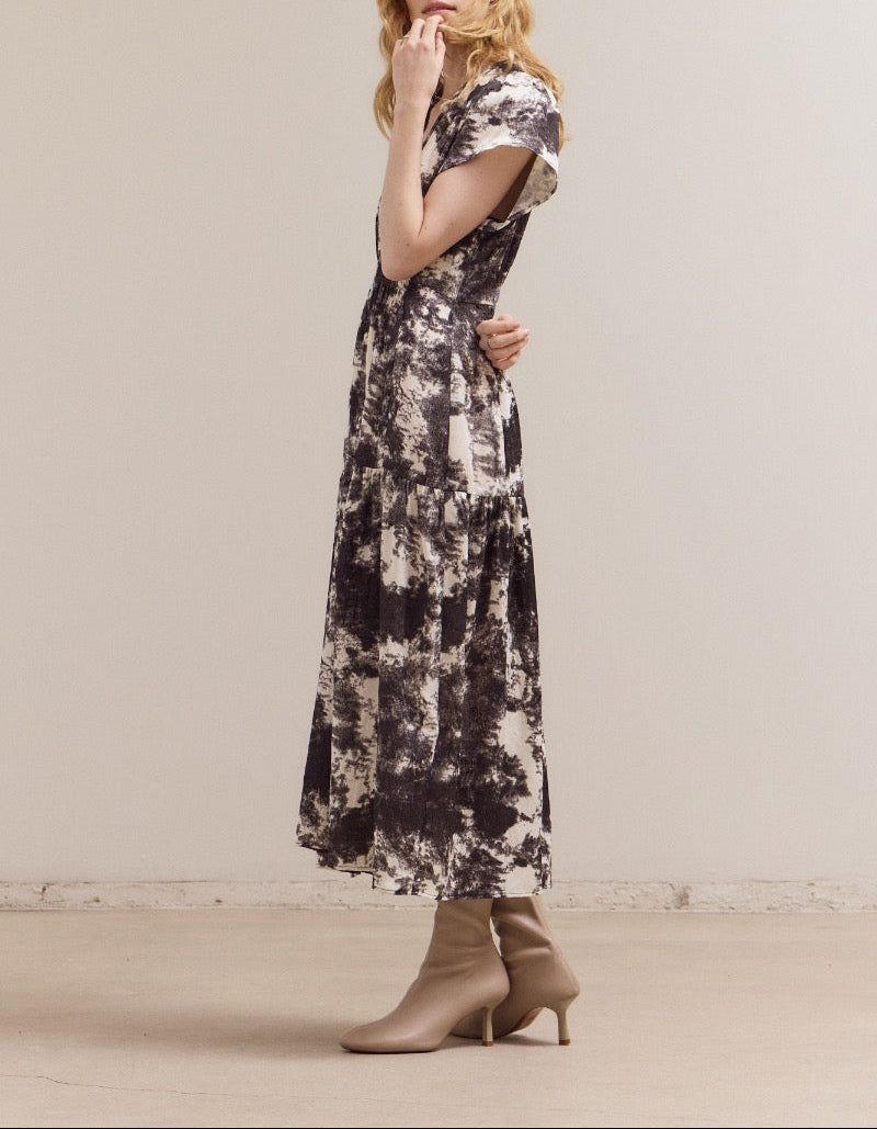 Ivory printed ruffle satin midi dress by Grade & Gather with short sleeves and a flowing silhouette.