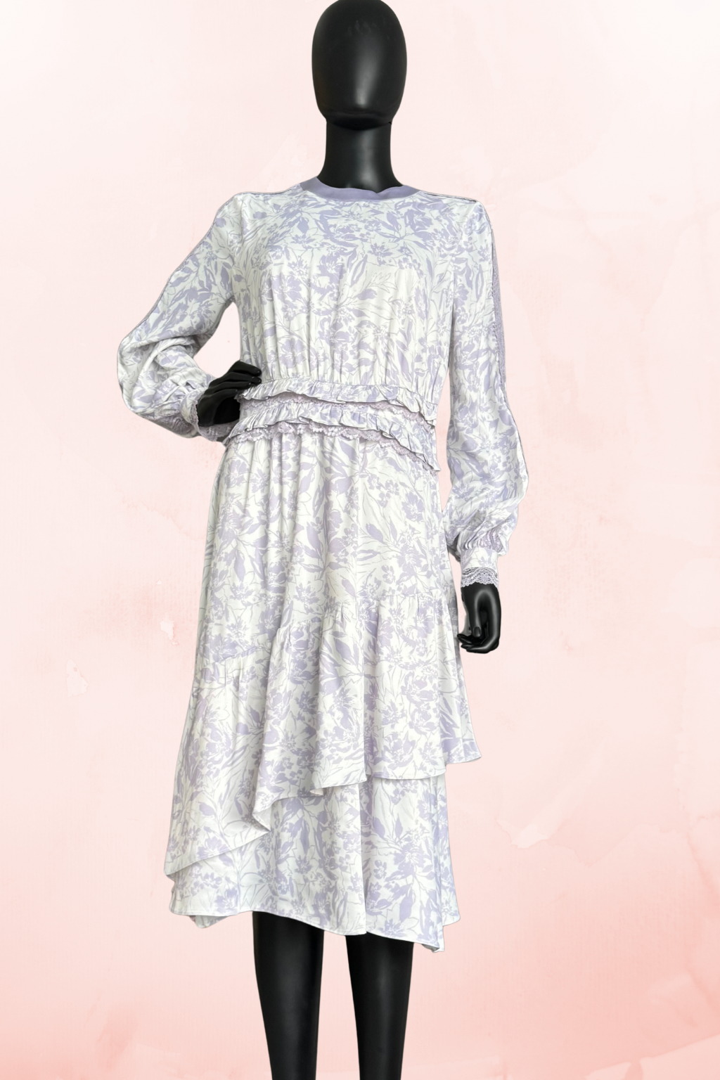 Lilac floral midi dress by Qui Prive featuring long sleeves, a modest crew neckline, tiered skirt detail, and elegant floral print, perfect for daytime events.