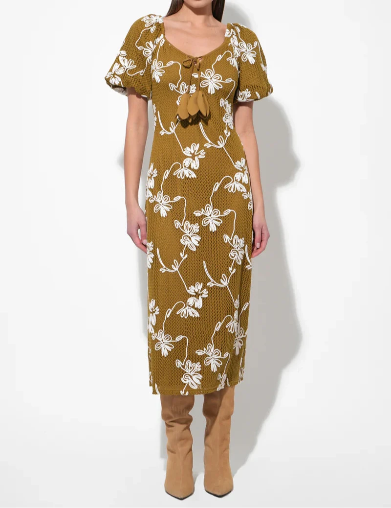 Moss green textured knit midi dress with ivory floral pattern, puff sleeves and tassel‑tie scoop neckline.
