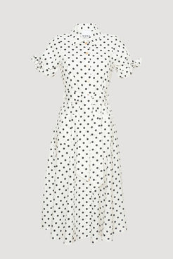 White midi-length polka dot shirt dress with black dots, collar, button-down front, and tie sleeves 