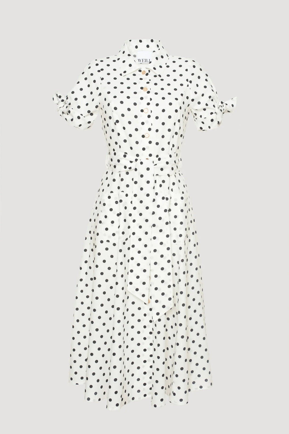 White midi-length polka dot shirt dress with black dots, collar, button-down front, and tie sleeves 