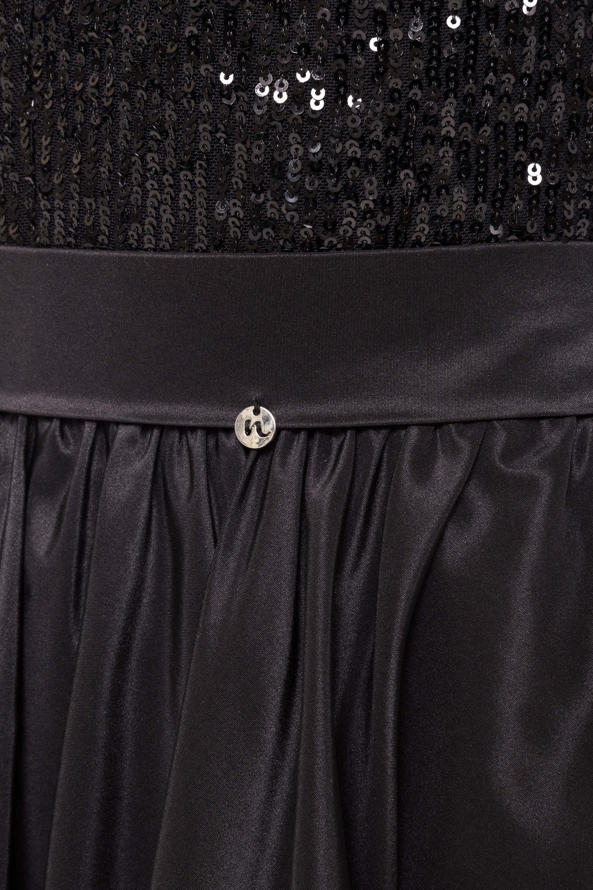 Close‑up of the satin‑finish waistband, gathered taffeta skirt and sequin bodice, highlighting texture and craftsmanship