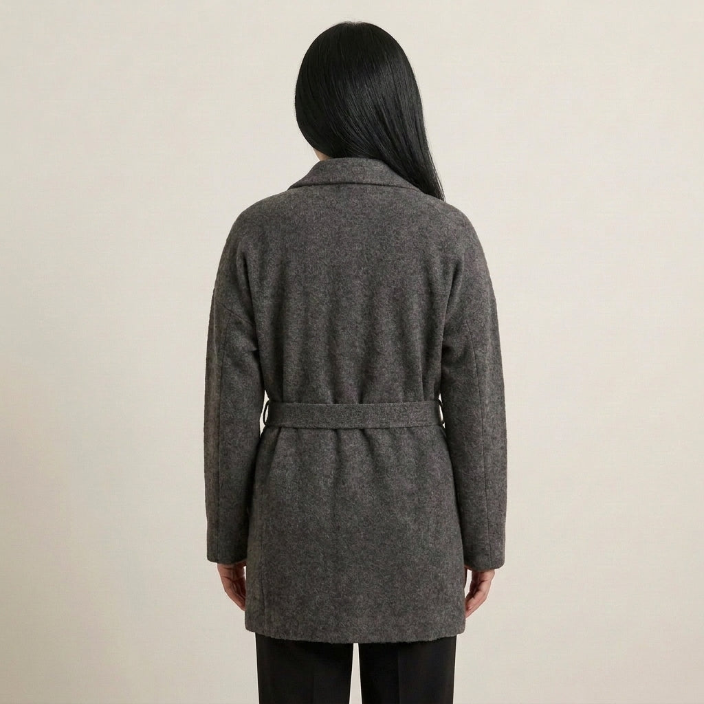 Three-quarter view of Allie Rose charcoal wrap jacket with a tied knit belt, long sleeves and patch pockets.
