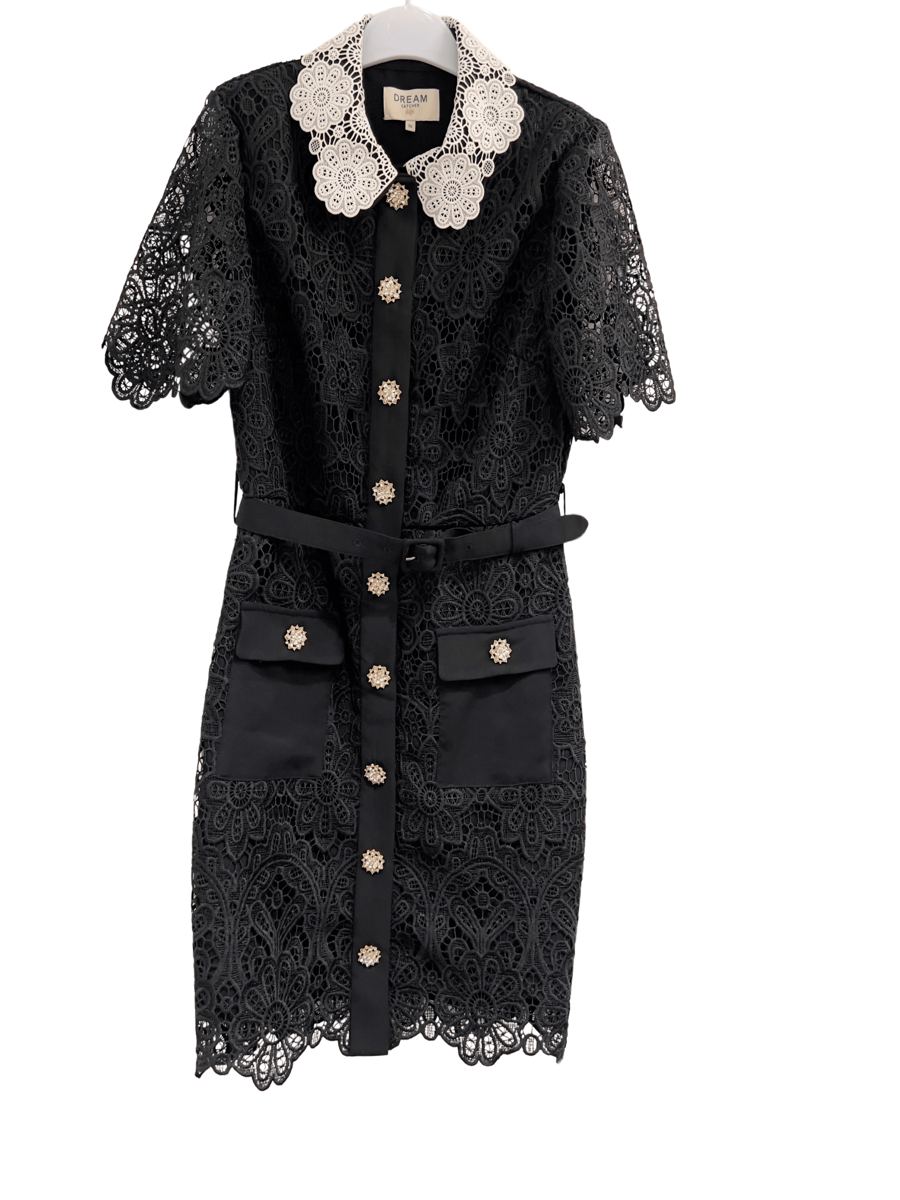 Elegant black lace dress with a distinctive white lace collar, short lace sleeves, and a row of decorative buttons down the front, displayed on a hanger -BTK COLLECTION
