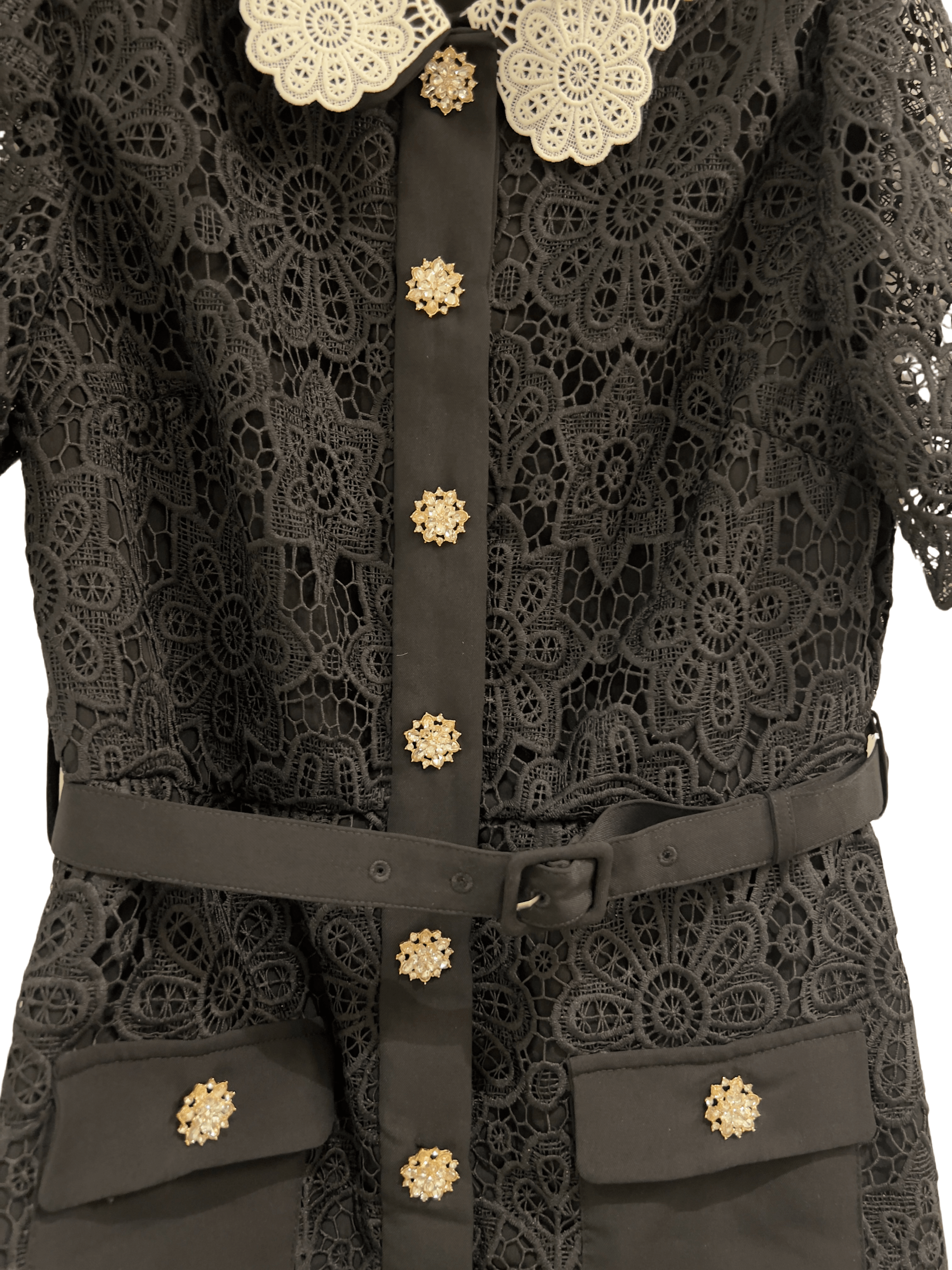 Elegant black lace dress with a distinctive white lace collar, short lace sleeves, and a row of decorative buttons down the front, displayed on a hanger - BTK COLLECTION