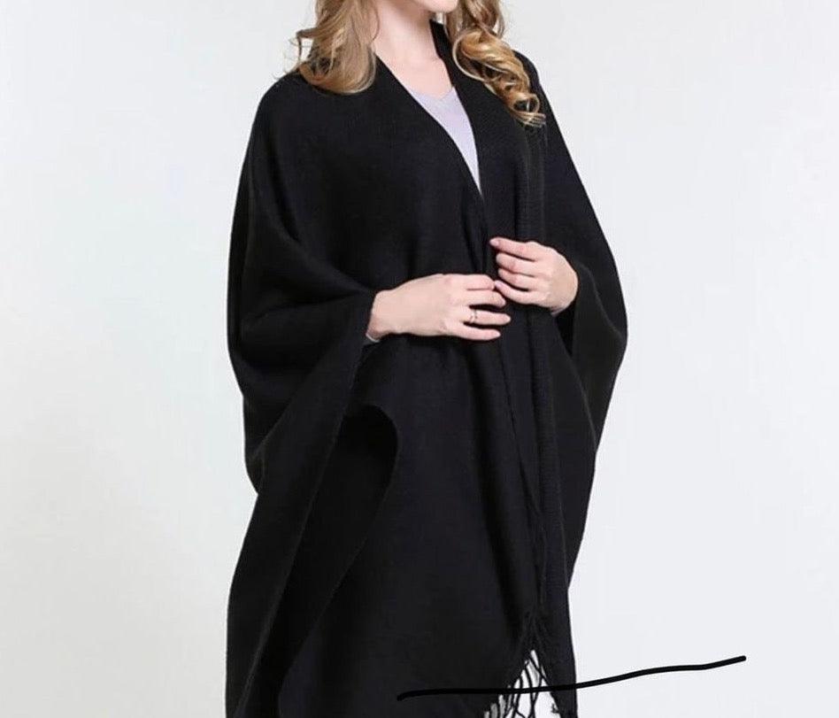 Open-front black poncho shawl styled as ruana with fringe