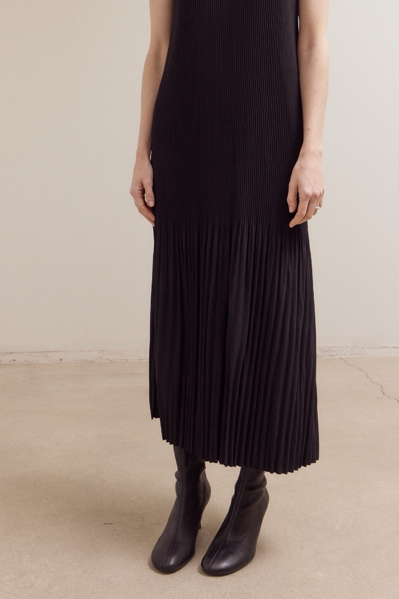 Black wrinkled pleat sleeveless maxi dress by GRADE & GATHER with vertical accordion pleats.
