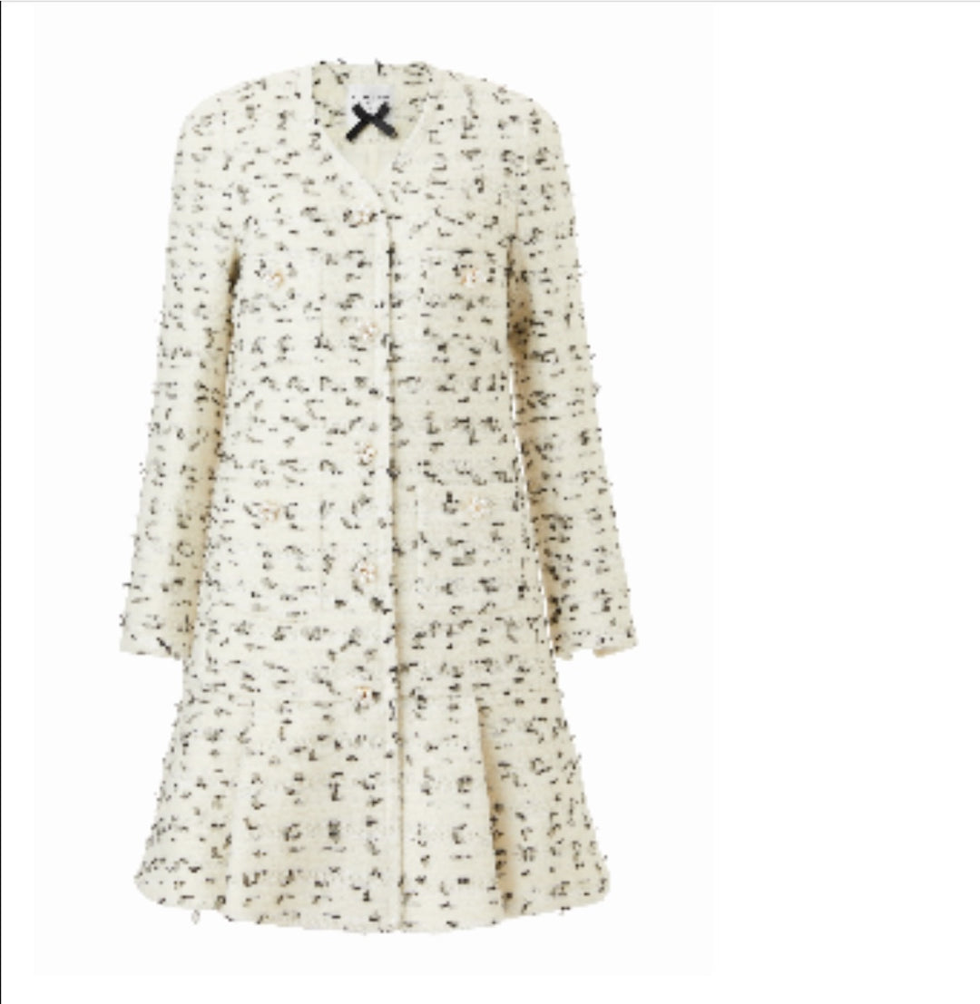 White coat dress with intricate detailing and bow accent by EDWARD ACHOUR