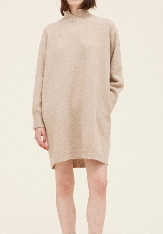 Front detail of Grade & Gather Ecru mini sweater dress with a raised neckline and long sleeves