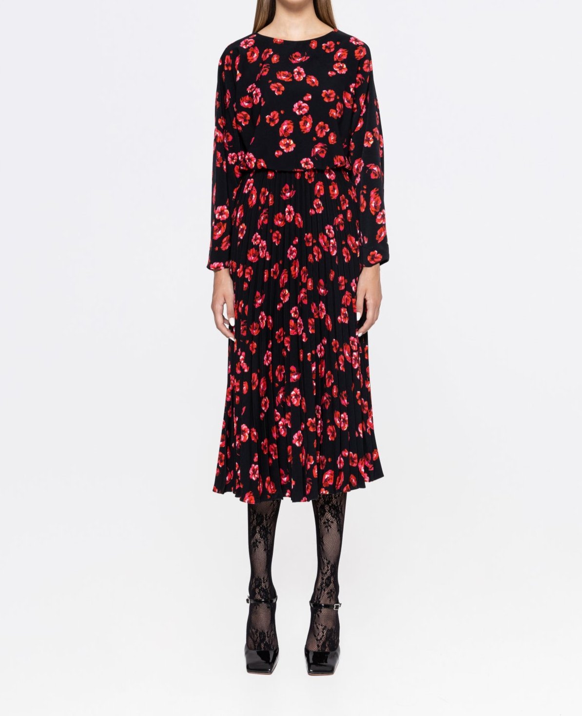 Front view of black poppy‑print pleated midi dress with crew neck and long sleeves